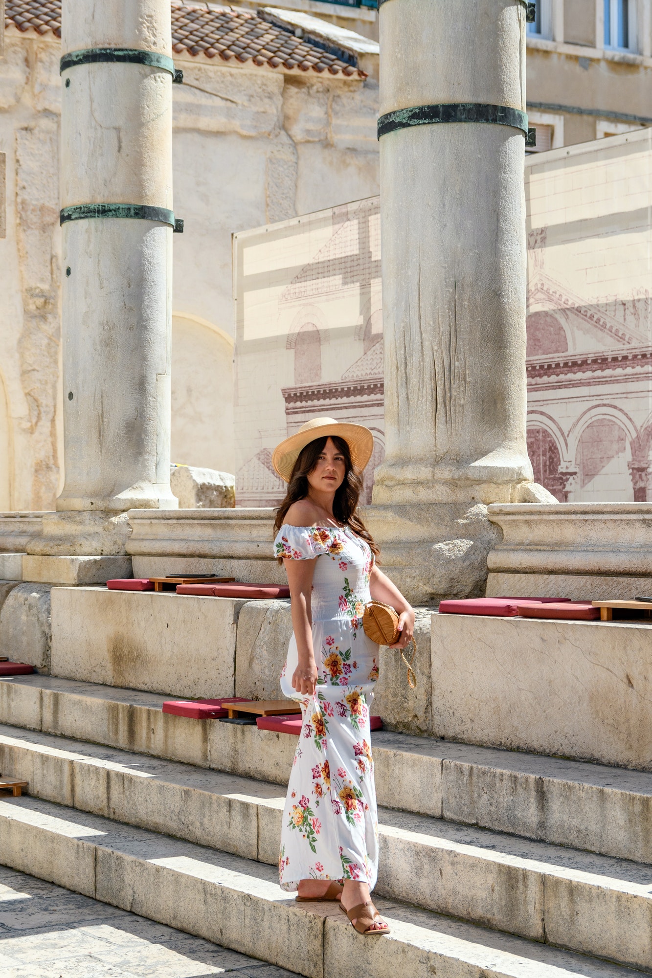 Beautiful woman standing on peristyle of amazing Diocletian's palace in Split, Croatia